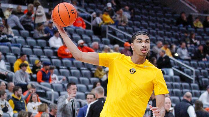Trent Burns passes the ball during warmups ahead of the Braggin Rights game vs Illinois Trent Burns passes the ball during warmups ahead of the Braggin Rights game vs Illinois