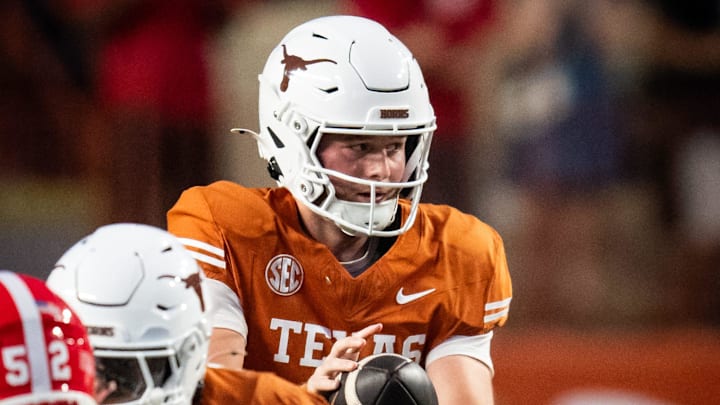 Oct 19, 2024; Austin, Texas, USA; Texas Longhorns quarterback Quinn Ewers (3) takes a snap against the Georgia Bulldogs in the first quarter at Darrell K. Royal Texas Memorial Stadium. Mandatory Credit: Sara Diggins/USA TODAY Network via Imagn Images