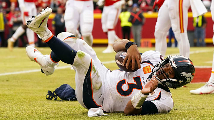 Jan 1, 2023; Kansas City, Missouri, USA; Denver Broncos quarterback Russell Wilson (3) scores a