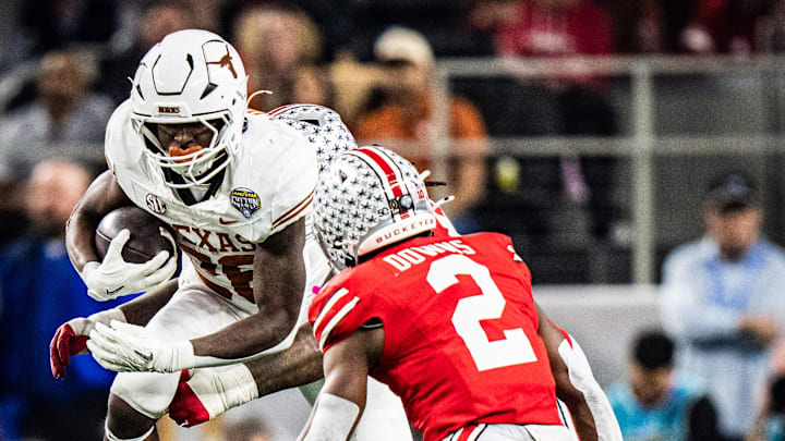 Texas Longhorns running back Quintrevion Wisner (26) runs through Ohio State defense in the second quarter as the Texas Longhorns play the Ohio State Buckeyes in the Cotton Bowl College Football Playoff semi-final at AT&T Stadium in Dallas, Texas, Jan. 10, 2025. Texas Longhorns running back Quintrevion Wisner (26) runs through Ohio State defense in the second quarter as the Texas Longhorns play the Ohio State Buckeyes in the Cotton Bowl College Football Playoff semi-final at AT&T Stadium in Dallas, Texas, Jan. 10, 2025.