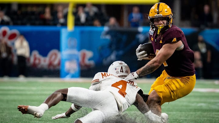 Arizona State Sun Devils running back Cam Skattebo (4) put on a show during the 2024 Peach Bowl. Arizona State Sun Devils running back Cam Skattebo (4) put on a show during the 2024 Peach Bowl.