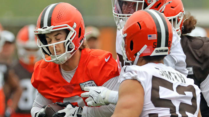 Cleveland Browns quarterback Kenny Pickett finds himself overwhelmed by a pair of defenders during an NFL practice at the Cleveland Browns training facility on Wednesday, May 28, 2025, in Berea, Ohio.