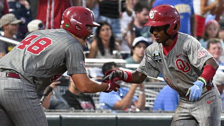 Oklahoma Sooners center fielder Jason Walk celebrates with catcher Deiten Lachance (48) after hitting a home run against the Georgia Bulldogs. Oklahoma Sooners center fielder Jason Walk celebrates with catcher Deiten Lachance (48) after hitting a home run against the Georgia Bulldogs.