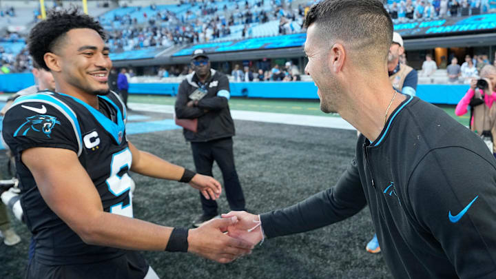 Nov 3, 2024; Charlotte, North Carolina, USA; Carolina Panthers quarterback Bryce Young (9) with head coach Dave Canales after the game at Bank of America Stadium. 