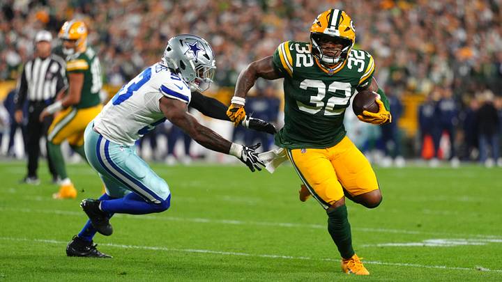 Green Bay Packers running back MarShawn Lloyd (32) runs the ball against Dallas Cowboys linebacker Dee Winters (53) during the first quarter at Lambeau Field. Mandatory Credit: Ross Harried-Imagn Images Green Bay Packers running back MarShawn Lloyd (32) runs the ball against Dallas Cowboys linebacker Dee Winters (53) during the first quarter at Lambeau Field. Mandatory Credit: Ross Harried-Imagn Images