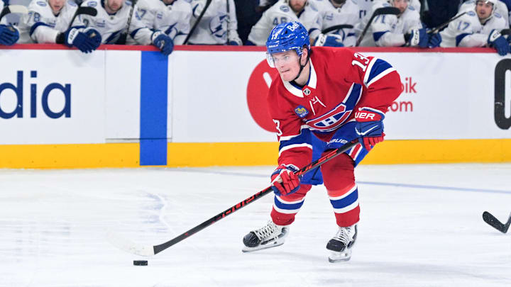 Apr 24, 2026; Montreal, Quebec, CAN; Montreal Canadiens forward Cole Caufield (13) plays the puck against the Tampa Bay Lightning during the third period in game three of the first round of the 2026 Stanley Cup Playoffs at the Bell Centre. Mandatory Credit: Eric Bolte-Imagn Images