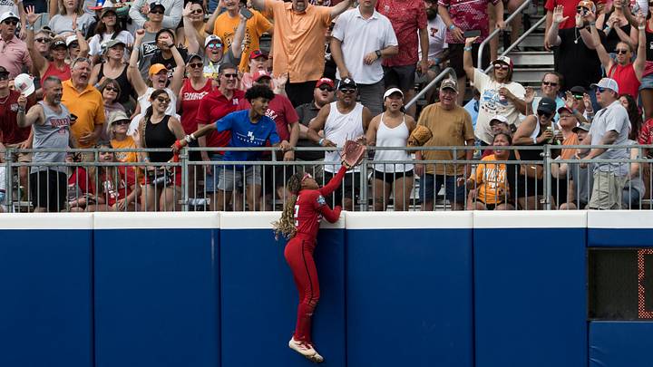 May 30, 2026; Oklahoma City, OK, USA;  Texas Tech Red Raiders outfielder Mihyia Davis (42) makes an attempt to catch the walk-off home run ball by Tennessee Lady Volunteers infielder Emma Clarke (not pictured) to end the game during the NCAA Women’s College World Series at Devon Park. Mandatory Credit: Brett Rojo-Imagn Images