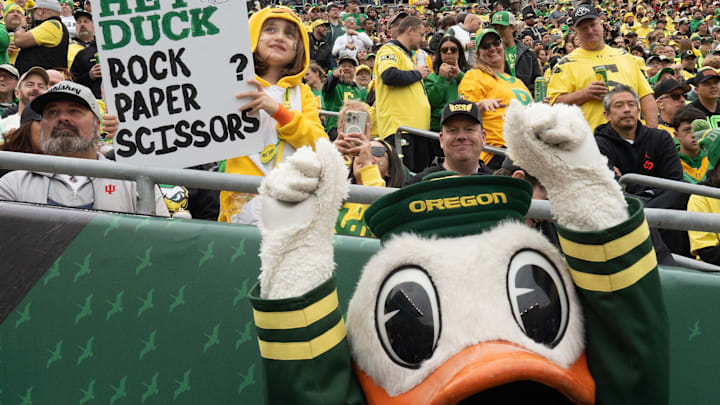 Eight-year-old Parker, left, challenges the Duck to a game of Rock, Paper, Scissors during the game against Indiana at Autzen Stadium October 11, 2025. Eight-year-old Parker, left, challenges the Duck to a game of Rock, Paper, Scissors during the game against Indiana at Autzen Stadium October 11, 2025.