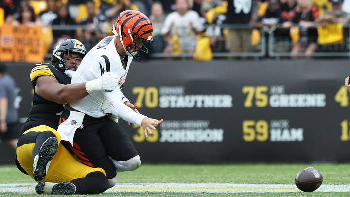 Sep 27, 2026; Pittsburgh, Pennsylvania, USA;  Pittsburgh Steelers defensive tackle Derrick Harmon (99) strips Cincinnati Bengals quarterback Joe Burrow (9) during the fourth quarter at Acrisure Stadium.  Mandatory Credit: Charles LeClaire-Imagn Images