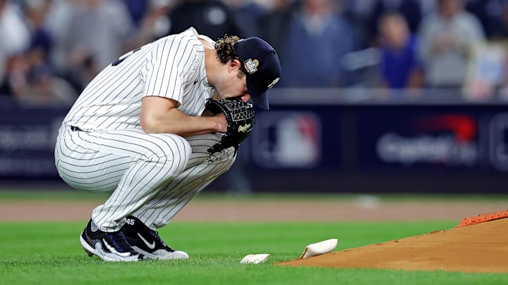 Oct 30, 2024; New York, New York, USA; New York Yankees pitcher Gerrit Cole (45) kneels behind the pitchers mound before throwing the first pitch against the Los Angeles Dodgers in game four of the 2024 MLB World Series at Yankee Stadium. Mandatory Credit: Brad Penner-Imagn Images Oct 30, 2024; New York, New York, USA; New York Yankees pitcher Gerrit Cole (45) kneels behind the pitchers mound before throwing the first pitch against the Los Angeles Dodgers in game four of the 2024 MLB World Series at Yankee Stadium. Mandatory Credit: Brad Penner-Imagn Images
