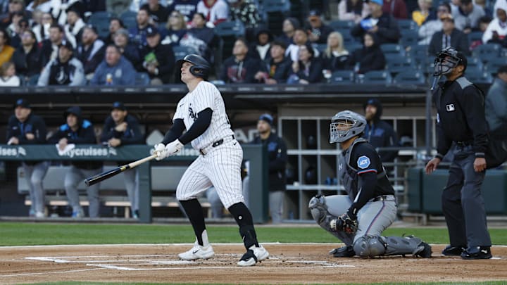 May 10, 2025; Chicago, Illinois, USA; Chicago White Sox designated hitter Andrew Vaughn (25) hits a solo home run against the Miami Marlins during the first inning at Rate Field. Mandatory Credit: Kamil Krzaczynski-Imagn Images