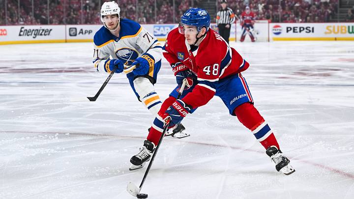 May 16, 2026; Montreal, Quebec, CAN; Montreal Canadiens defenseman Lane Hutson (48) plays the puck against Buffalo Sabres center Ryan McLeod (71) during the third period in game six of the second round of the 2026 Stanley Cup Playoffs at Bell Centre. Mandatory Credit: David Kirouac-Imagn Images