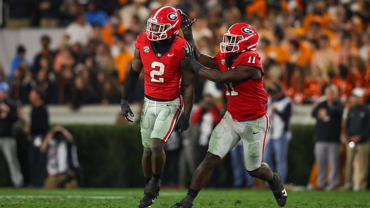 Nov 16, 2024; Athens, Georgia, USA; Georgia Bulldogs linebacker Smael Mondon Jr. (2) celebrates with linebacker Jalon Walker (11) after a tackle against the Tennessee Volunteers in the second quarter at Sanford Stadium. Mandatory Credit: Brett Davis-Imagn Images