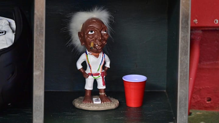 Sep 20, 2023; Phoenix, Arizona, USA;  A general view of a Jobu idol from the movie Major League sits among helmets in the Arizona Diamondbacks dugout prior to the game against the San Francisco Giants at Chase Field. Mandatory Credit: Matt Kartozian-Imagn Images