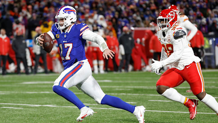 Buffalo Bills quarterback Josh Allen (17) sprints away from Kansas City Chiefs defensive end Neil Farrell (92) for some of his 72 yards.