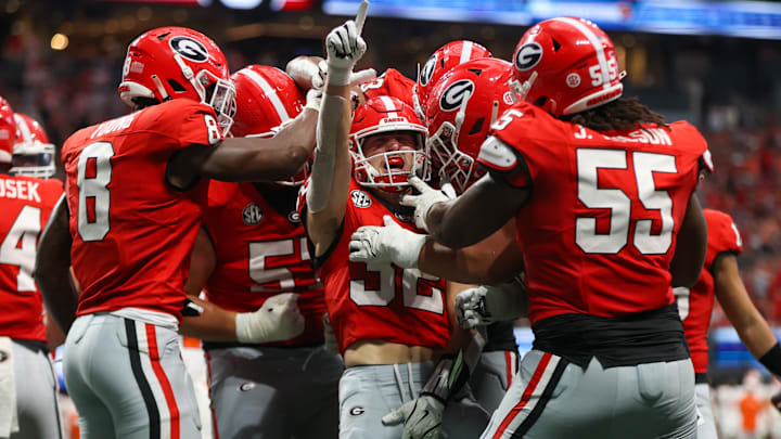 Aug 31, 2024; Atlanta, Georgia, USA; Georgia Bulldogs running back Cash Jones (32) celebrates with teammates after a touchdown against the Clemson Tigers in the third quarter at Mercedes-Benz Stadium. Mandatory Credit: Brett Davis-Imagn Images
Aug 31, 2024; Atlanta, Georgia, USA; Georgia Bulldogs running back Cash Jones (32) celebrates with teammates after a touchdown against the Clemson Tigers in the third quarter at Mercedes-Benz Stadium. Mandatory Credit: Brett Davis-Imagn Images