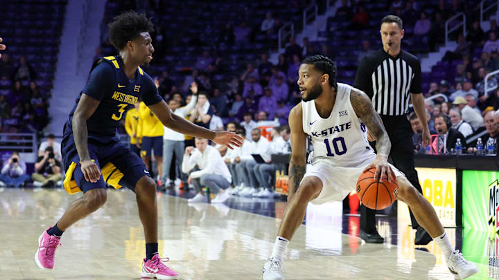 Mar 3, 2026; Manhattan, Kansas, USA; Kansas State Wildcats guard David Castillo (10) is guarded by West Virginia Mountaineers guard Honor Huff (3) during the second half at Bramlage Coliseum. Mandatory Credit: Scott Sewell-Imagn Images