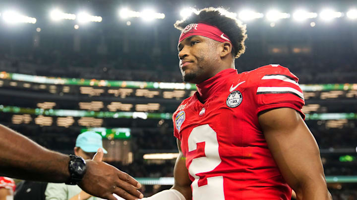 Ohio State Buckeyes defensive back Caleb Downs (2) leaves the field following the Cotton Bowl at AT&T Stadium in Arlington, Texas for the College Football Playoff quarterfinal game against the Miami Hurricanes on Dec. 31, 2025. Ohio State lost 24-14.