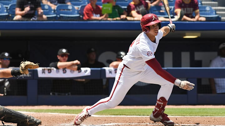 May 22 2024; Hoover, AL, USA; Arkansas batter Jared sprague-Lott serves a pitch into right field for a hit against South Carolina at the Hoover Met during the SEC Tournament.
