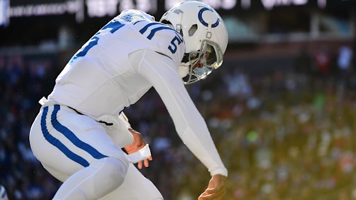 Dec 1, 2024; Foxborough, Massachusetts, USA;  Indianapolis Colts quarterback Anthony Richardson (5) spikes the ball after scoring a touchdown during the first half against the New England Patriots at Gillette Stadium. Mandatory Credit: Bob DeChiara-Imagn Images