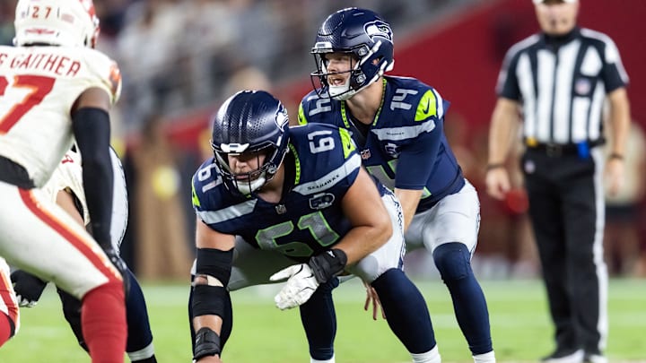 Sep 25, 2025; Glendale, Arizona, USA; Seattle Seahawks center Jalen Sundell (61) prepares to snap the ball to quarterback Sam Darnold (14) against the Arizona Cardinals at State Farm Stadium. Mandatory Credit: Mark J. Rebilas-Imagn Images Sep 25, 2025; Glendale, Arizona, USA; Seattle Seahawks center Jalen Sundell (61) prepares to snap the ball to quarterback Sam Darnold (14) against the Arizona Cardinals at State Farm Stadium. Mandatory Credit: Mark J. Rebilas-Imagn Images