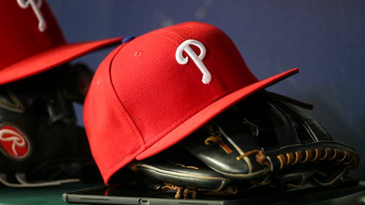 May 25, 2022; Atlanta, Georgia, USA; Detailed view of a Philadelphia Phillies hat and glove in the dugout against the Atlanta Braves in the eighth inning at Truist Park. Mandatory Credit: Brett Davis-USA TODAY Sports