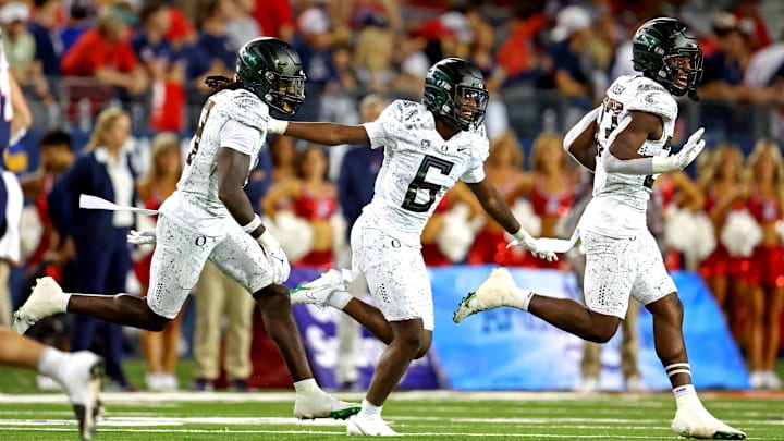 Oct 8, 2022; Tucson, Arizona, USA; Oregon Ducks defensive back Jahlil Florence (6) celebrates an interception during the second half against the Arizona Wildcats at Arizona Stadium. Mandatory Credit: Mark J. Rebilas-Imagn Images