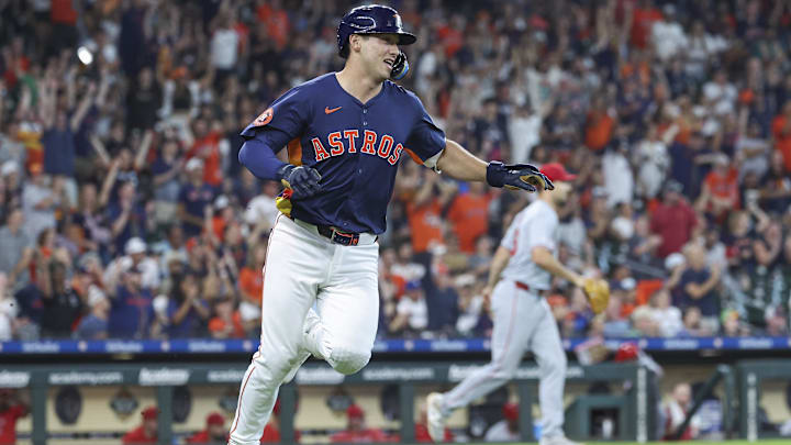 Houston Astros infielder Shay Whitcomb runs to first base on an RBI single against the Los Angeles Angels at Minute Maid Park. 