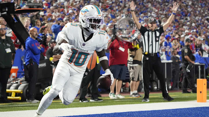 Miami Dolphins wide receiver Tyreek Hill (10) scores a touchdown against the Buffalo Bills in the fourth quarter at Highmark Stadium. Miami Dolphins wide receiver Tyreek Hill (10) scores a touchdown against the Buffalo Bills in the fourth quarter at Highmark Stadium.