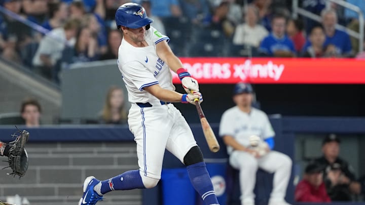 May 18, 2025; Toronto, Ontario, CAN; Toronto Blue Jays second baseman Ernie Clement (22) hits an RBI single against the Detroit Tigers during the fourth inning at Rogers Centre.
