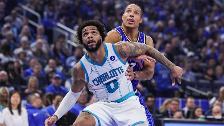 Charlotte Hornets forward Miles Bridges (0) and Orlando Magic guard Desmond Bane (3) look for the rebound 