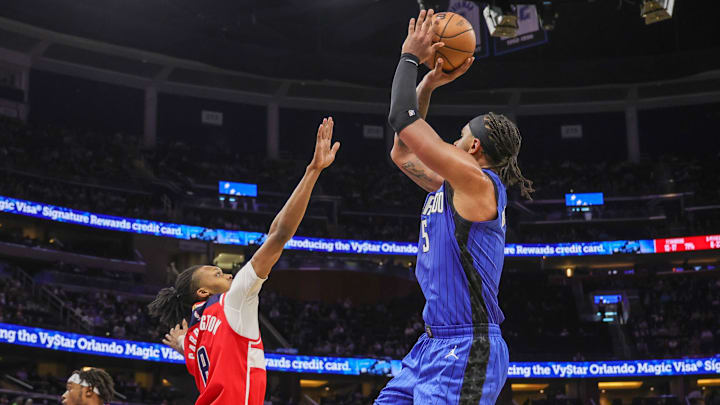 Orlando Magic forward Paolo Banchero (5) shoots over Washington Wizards guard Bub Carrington (8) during the second half at Kia Center.