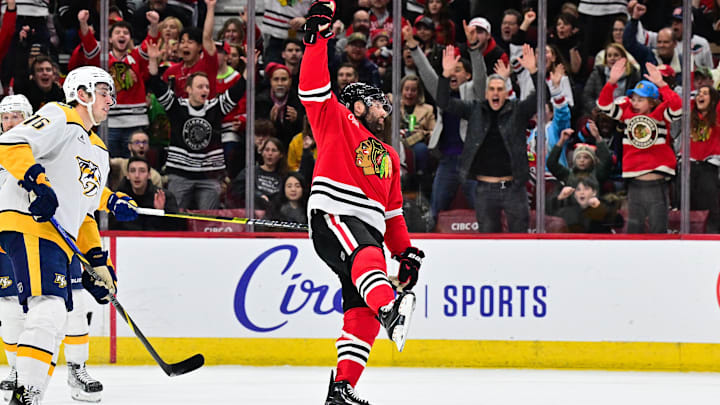 Feb 7, 2025; Chicago, Illinois, USA; Chicago Blackhawks left wing Pat Maroon (77) celebrates his goal against the Nashville Predators during the first period at the United Center. Mandatory Credit: Daniel Bartel-Imagn Images