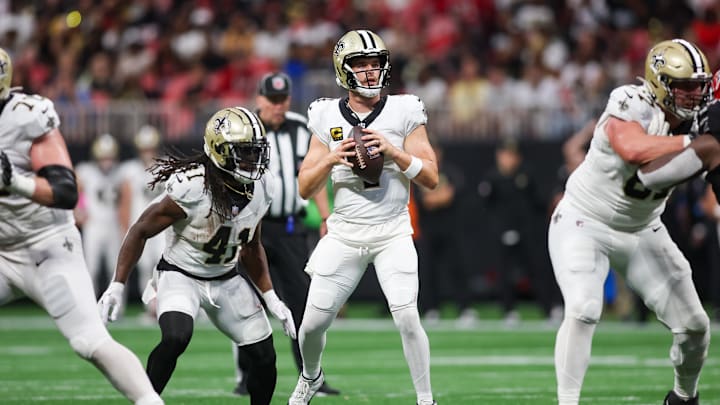 Sep 29, 2024; Atlanta, Georgia, USA; New Orleans Saints quarterback Derek Carr (4) drops back to pass against the Atlanta Falcons in the fourth quarter at Mercedes-Benz Stadium. Mandatory Credit: Brett Davis-Imagn Images