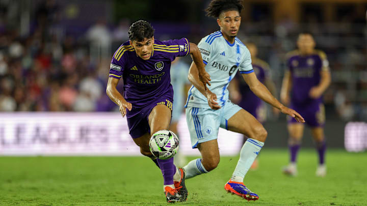 Jul 26, 2024; Orlando, Florida, USA; Orlando City forward Ramiro Enrique (7) and CF Montreal midfielder Nathan-Dylan Saliba (19) battle for the ball in the second half during the group stage of Leagues Cup at INTER&CO Stadium. Mandatory Credit: Nathan Ray Seebeck-USA TODAY Sports