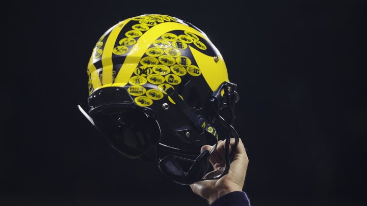 Dec 3, 2022; Indianapolis, Indiana, USA; A Michigan Wolverines player holds their helmet following their 43-22 victory against Purdue in the Big Ten Championship at Lucas Oil Stadium. Mandatory Credit: Trevor Ruszkowski-USA TODAY Sports