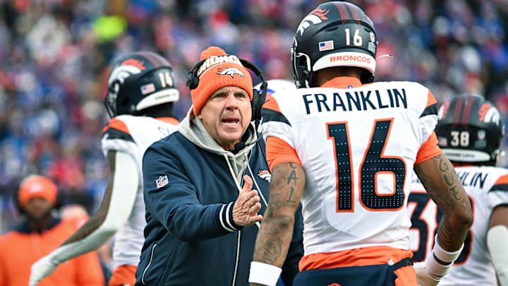 Jan 12, 2025; Orchard Park, New York, USA; Denver Broncos head coach Sean Payton has a word with wide receiver Troy Franklin (16) in the fourth quarter of an AFC wild card game against the Buffalo Bills at Highmark Stadium. 