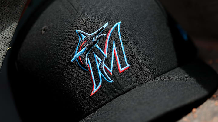 A view of a New Era Miami Marlins hat in the dugout during the game against the Cincinnati Reds at Great American Ball Park. 