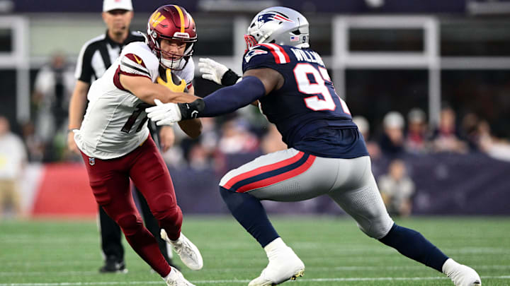 Aug 8, 2025; Foxborough, Massachusetts, USA; New England Patriots defensive end Milton Williams (97) tackles Washington Commanders wide receiver Luke McCaffrey (11) during the first half at Gillette Stadium. Mandatory Credit: Brian Fluharty-Imagn Images