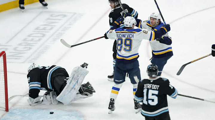 Feb 2, 2025; Salt Lake City, Utah, USA; St. Louis Blues center Jordan Kyrou (25) and left wing Pavel Buchnevich (89) celebrate a Blues goal against the Utah Hockey Club during the third period at Delta Center. Mandatory Credit: Chris Nicoll-Imagn Images