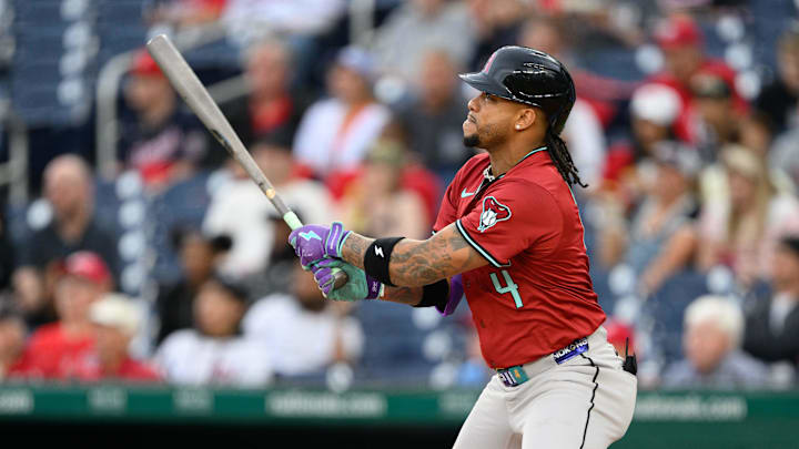 Apr 4, 2025; Washington, District of Columbia, USA; Arizona Diamondbacks second base Ketel Marte (4) hits a double during the first inning against the Washington Nationals at Nationals Park. Mandatory Credit: Reggie Hildred-Imagn Images