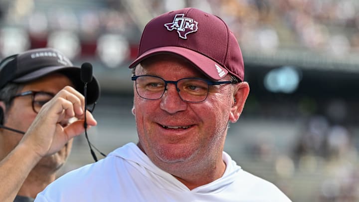 Oct 5, 2024; College Station, Texas, USA; Texas A&M Aggies head coach Mike Elko gets ready for a pre-game interview with the SEC Nation prior to the game against the Missouri Tigers at Kyle Field. Mandatory Credit: Maria Lysaker-Imagn Images. 