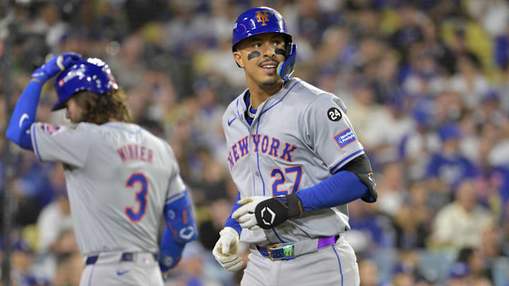 Oct 20, 2024; Los Angeles, California, USA; New York Mets third baseman Mark Vientos (27) celebrates after hitting a two run home run in the fourth inning against the Los Angeles Dodgers during game six of the NLCS for the 2024 MLB playoffs at Dodger Stadium. Mandatory Credit: Jayne Kamin-Oncea-Imagn Images