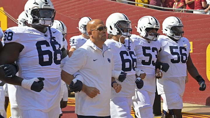 Oct 12, 2024; Los Angeles, California, USA; Penn State Nittany Lions head coach James Franklin locks arms with players as they head on to United Airlines Field for the game against the USC Trojans at the Los Angeles Memorial Coliseum. Mandatory Credit: Jayne Kamin-Oncea-Imagn Images Oct 12, 2024; Los Angeles, California, USA; Penn State Nittany Lions head coach James Franklin locks arms with players as they head on to United Airlines Field for the game against the USC Trojans at the Los Angeles Memorial Coliseum. Mandatory Credit: Jayne Kamin-Oncea-Imagn Images