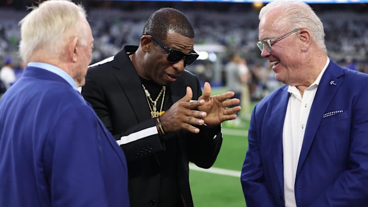 Colorado Buffaloes head coach Deion Sanders talks with Dallas Cowboys owner Jerry Jones and Cowboys CEO Stephen Jones.