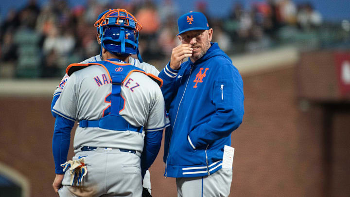 Apr 23, 2024; San Francisco, California, USA; New York Mets pitching coach Jeremy Hefner (right) visits the mound to speak with pitcher Luis Severino (40) and catcher Omar Narvaez (2) during the fifth inning against the San Francisco Giants at Oracle Park. Mandatory Credit: Ed Szczepanski-Imagn Images
