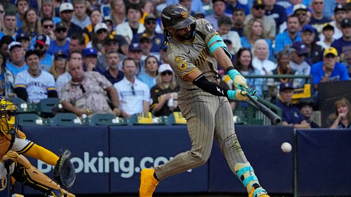 Oct 4, 2026; Milwaukee, Wisconsin, USA; San Diego Padres outfielder Fernando Tatis Jr. (23) hits a base hit during the fourth inning against the Milwaukee Brewers in game two of the NLDS for the 2026 MLB Playoffs at American Family Field. Mandatory Credit: Michael McLoone-Imagn Images Oct 4, 2026; Milwaukee, Wisconsin, USA; San Diego Padres outfielder Fernando Tatis Jr. (23) hits a base hit during the fourth inning against the Milwaukee Brewers in game two of the NLDS for the 2026 MLB Playoffs at American Family Field. Mandatory Credit: Michael McLoone-Imagn Images