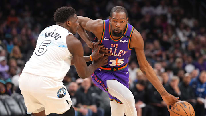 Mar 2, 2025; Phoenix, Arizona, USA; Phoenix Suns forward Kevin Durant (35) dribbles against Minnesota Timberwolves guard Anthony Edwards (5) during the second half at Footprint Center. Mandatory Credit: Joe Camporeale-Imagn Images Mar 2, 2025; Phoenix, Arizona, USA; Phoenix Suns forward Kevin Durant (35) dribbles against Minnesota Timberwolves guard Anthony Edwards (5) during the second half at Footprint Center. Mandatory Credit: Joe Camporeale-Imagn Images