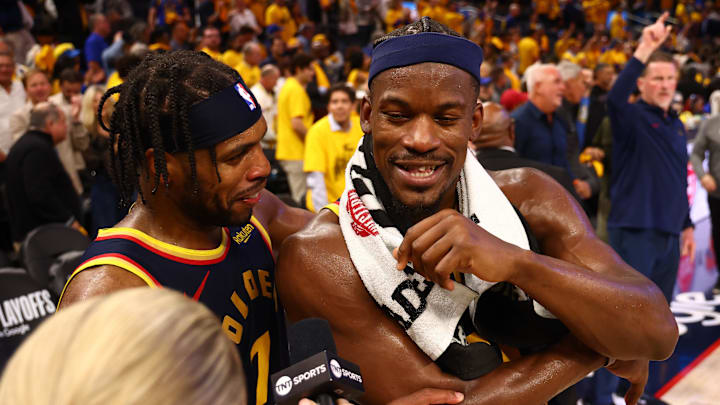Apr 28, 2025; San Francisco, California, USA; Golden State Warriors guard Buddy Hield (7) celebrates with forward Jimmy Butler III (10) as he speaks to TNT after the game four of the 2025 NBA Playoffs first round against the Houston Rockets at Chase Center. Mandatory Credit: Kelley L Cox-Imagn Images