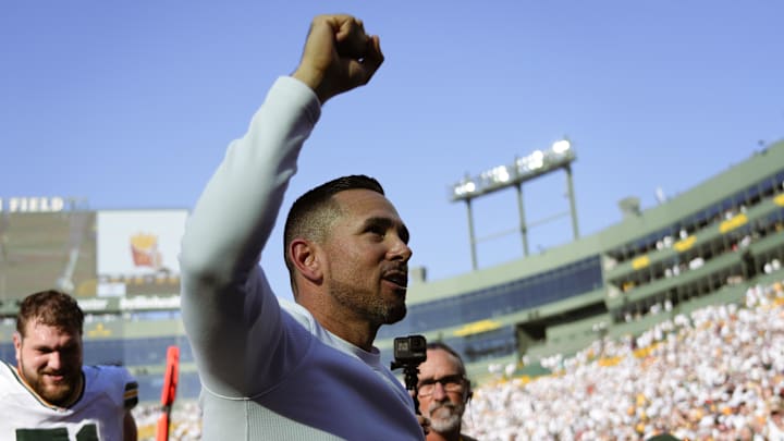 Oct 20, 2024; Green Bay, Wisconsin, USA;  Green Bay Packers head coach Matt LaFleur celebrates while walking off the field following the game against the Houston Texans at Lambeau Field. Mandatory Credit: Jeff Hanisch-Imagn Images